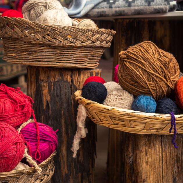 display of alpaca wool inside wicker baskets